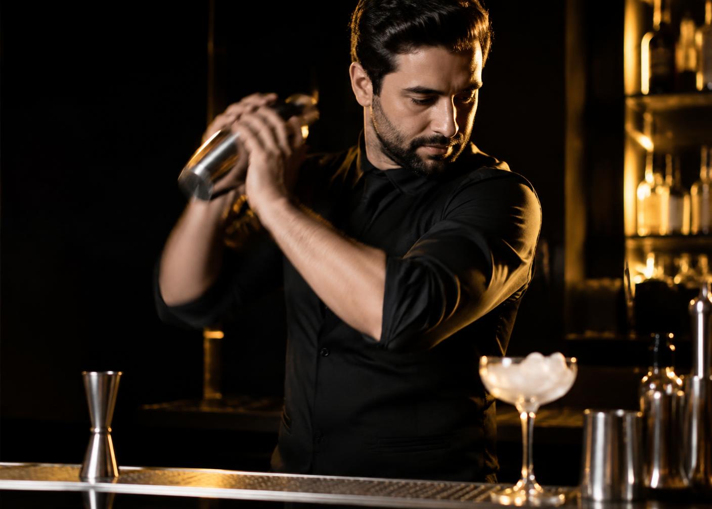A professional bartender preparing a drink